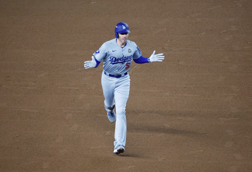 Freddie Freeman #5 of the Los Angeles Dodgers reacts as he rounds the bases on his two-run home run during the first inning.