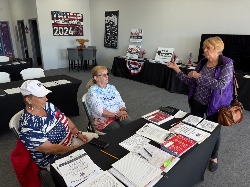 Mesquite, Nevada, GOP Volunteers Sandy Sorenson and Karen Campbell speaking with local Trump voter Lee McCord around a table