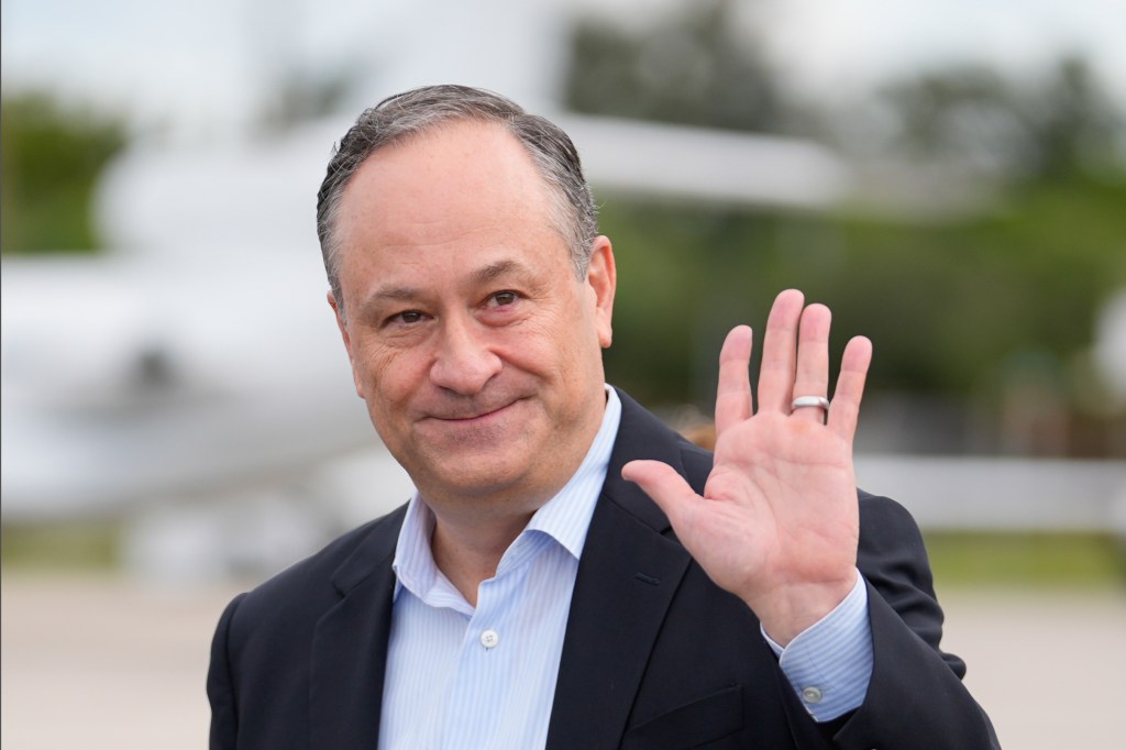 Second gentleman Doug Emhoff waves as he arrives at Fort Lauderdale-Hollywood International Airport to campaign in support of his wife, Democratic presidential nominee Vice President Kamala Harris,Wednesday, Oct. 23, 2024, in Fort Lauderdale, Fla. 