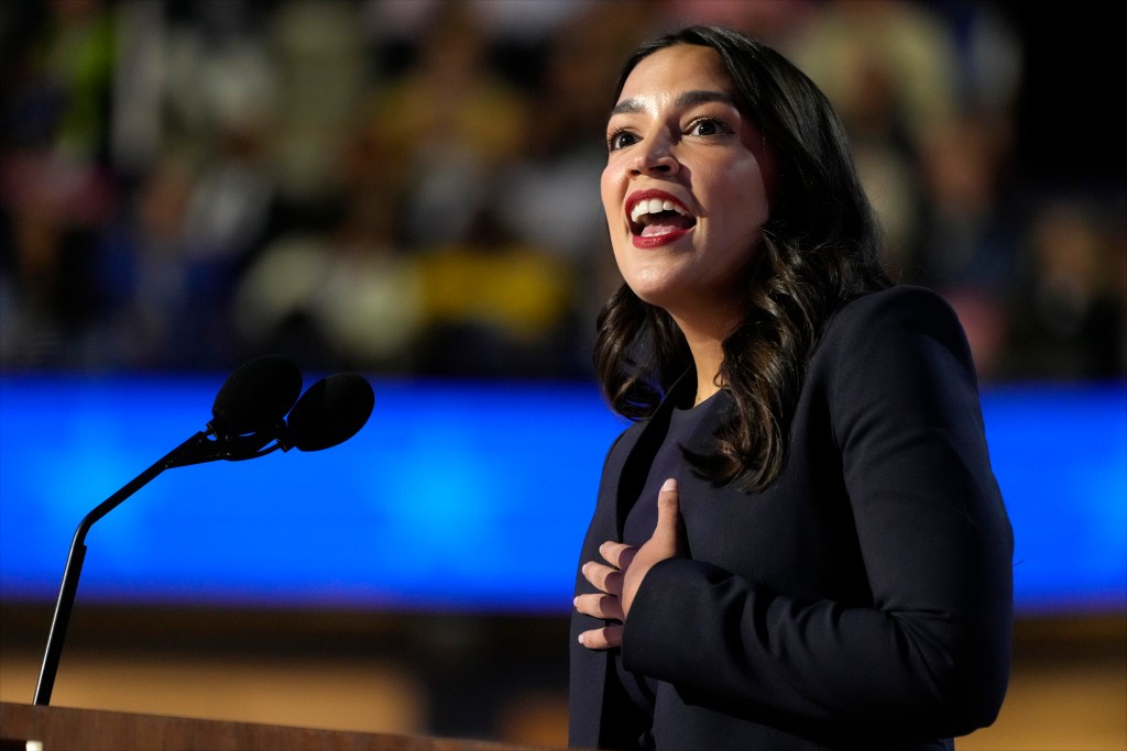 Rep. Alexandria Ocasio-Cortez speaking at the podium during the first day of the 2024 Democratic National Convention in Chicago