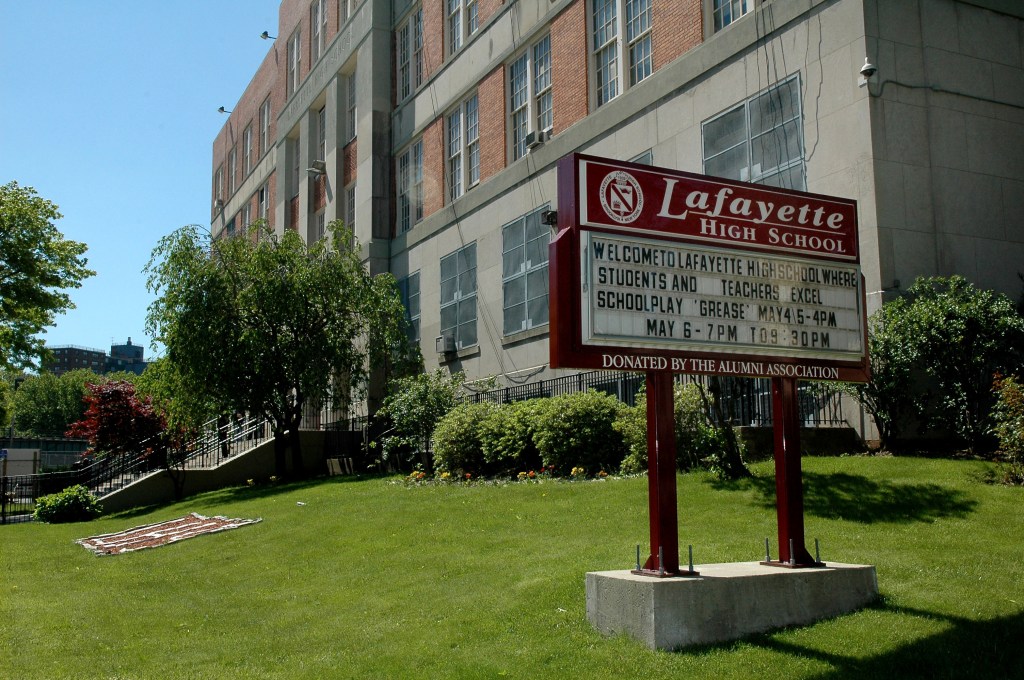 A teacher at International High School at Lafayette allegedly put a 15-year-old student in a headlock on Tuesday.