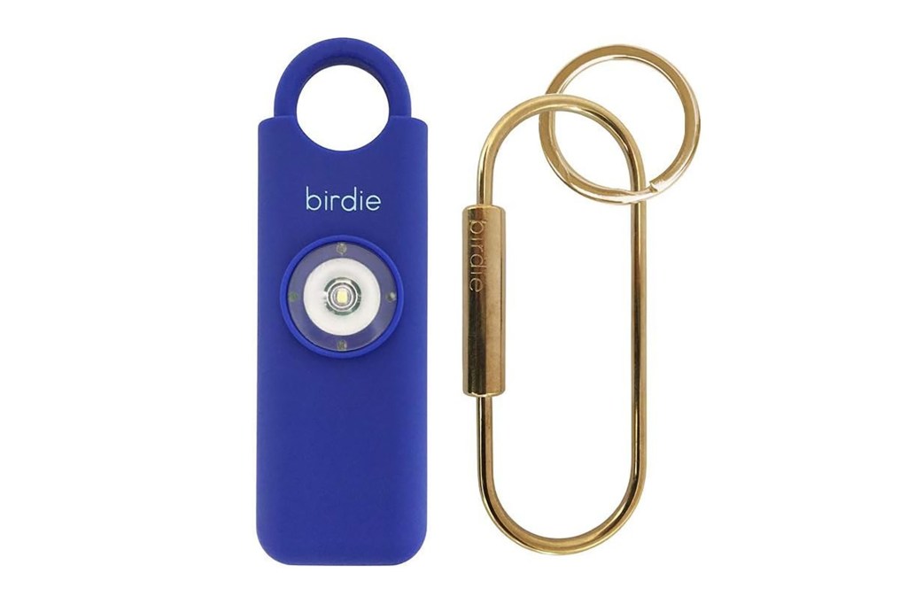 A blue keychain with a round light