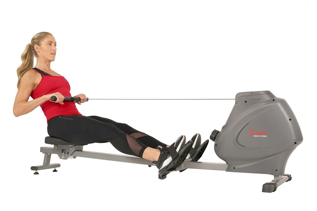 Woman using rowing machine