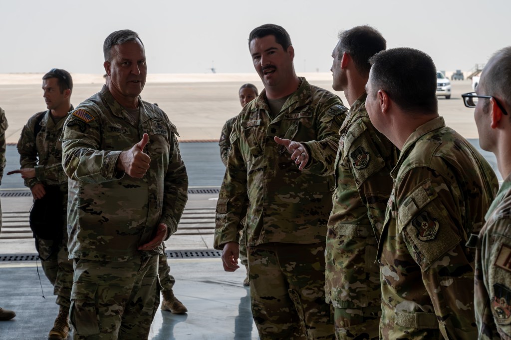 U.S. Air Force Gen. Michael Kurilla receiving a briefing from Lt. Col. Ian Shelley in an undisclosed military location