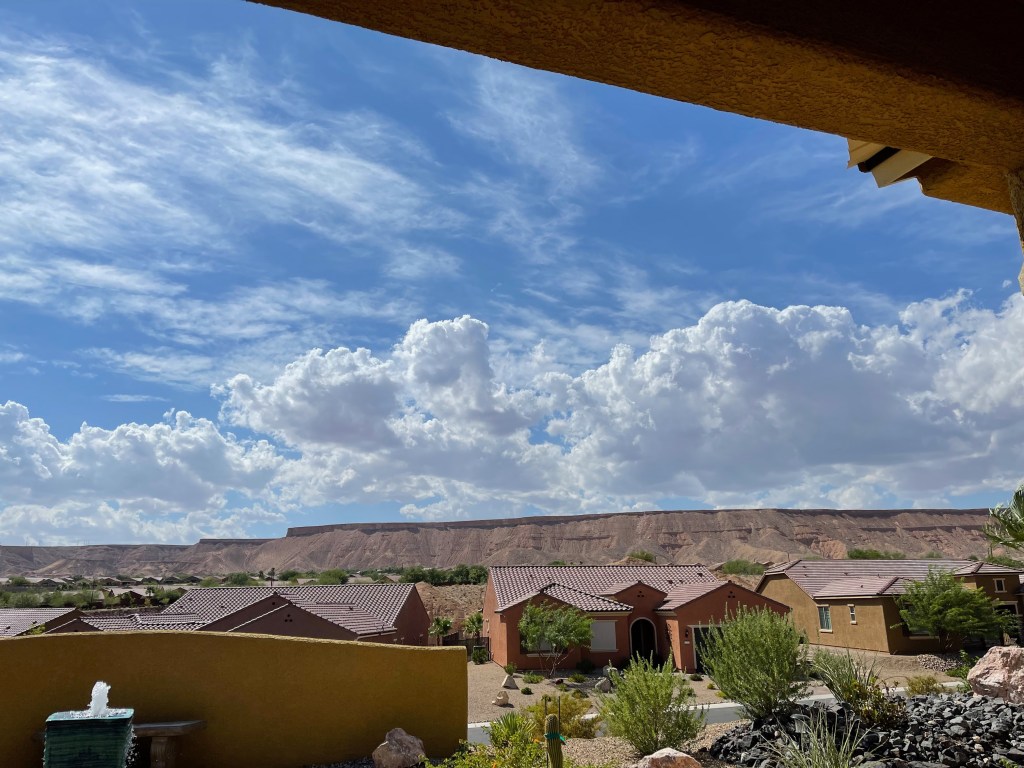 Retirees and others drawn to Sun City Mesquite in Nevada enjoying views of local mesas and comfortable backyards.