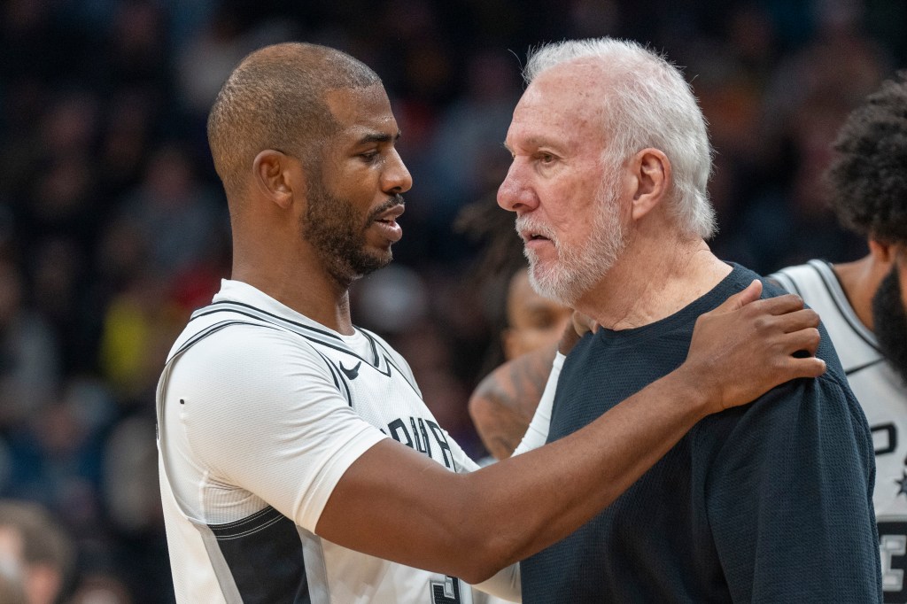 Spurs guard Chris Paul has a word with coach Gregg Popovich, during the second half of an NBA basketball game against the Utah Jazz, Thursday, Oct. 31, 2024,