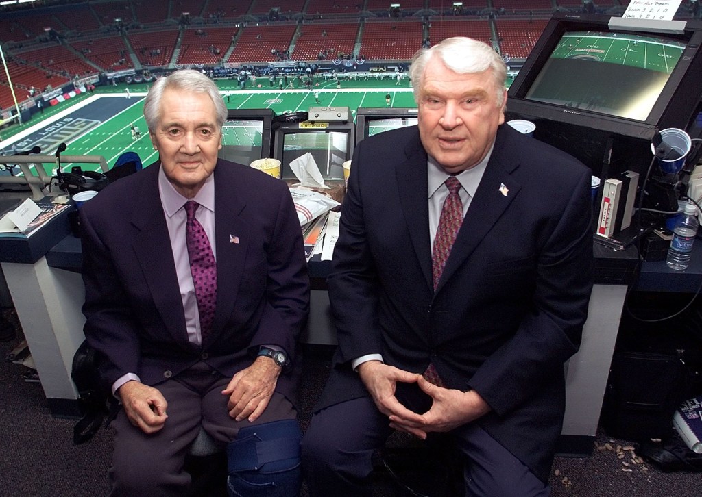 Pat Summerall and John Madden in the FOX broadcast booth before the NFC divisional playoff in this Jan. 20, 2002 photo in St. Louis.