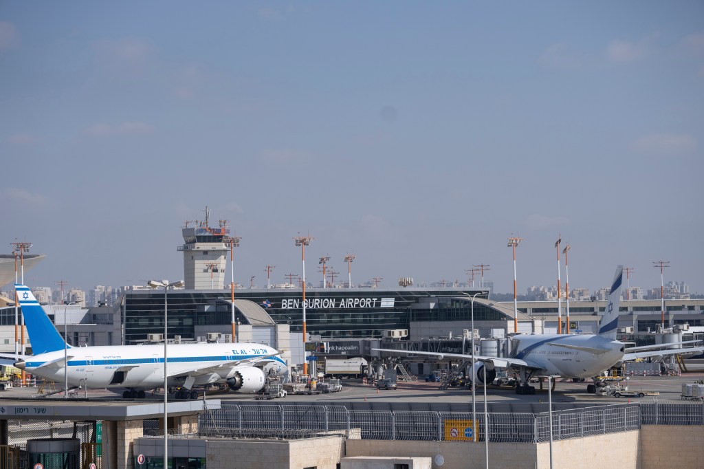 Two planes are parked at Ben Gurion International Airport near Tel Aviv, Israel, Monday Sept. 2, 2024. Outgoing flights at the airport were halted for two hours on Monday morning as part of a general strike launched in response to the deaths of hostages held in Gaza. (AP Photo/Ohad Zwigenberg)