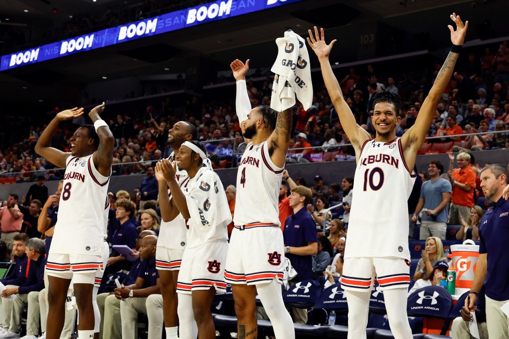 Auburn guard Chad Baker-Mazara (10) and teammates react after a slam dunk by forward Jahki Howard.