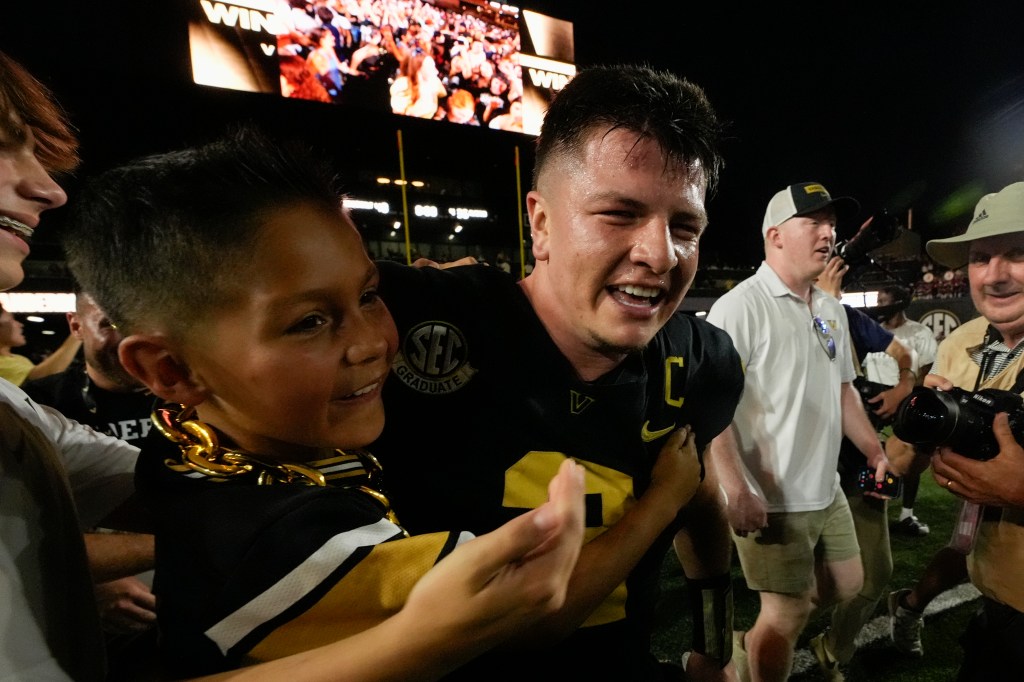 Diego Pavia, center, celebrates the team's 40-35 win over No. 1 Alabama after an NCAA college football game Saturday, Oct. 5, 2024, in Nashville, Tenn.