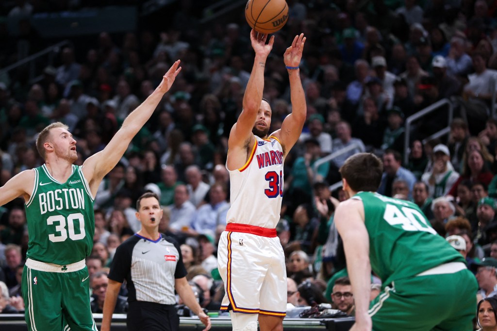 Golden State Warriors guard Stephen Curry (30) shoots during the second half against the Boston Celtics at TD Garden on Nov. 6.