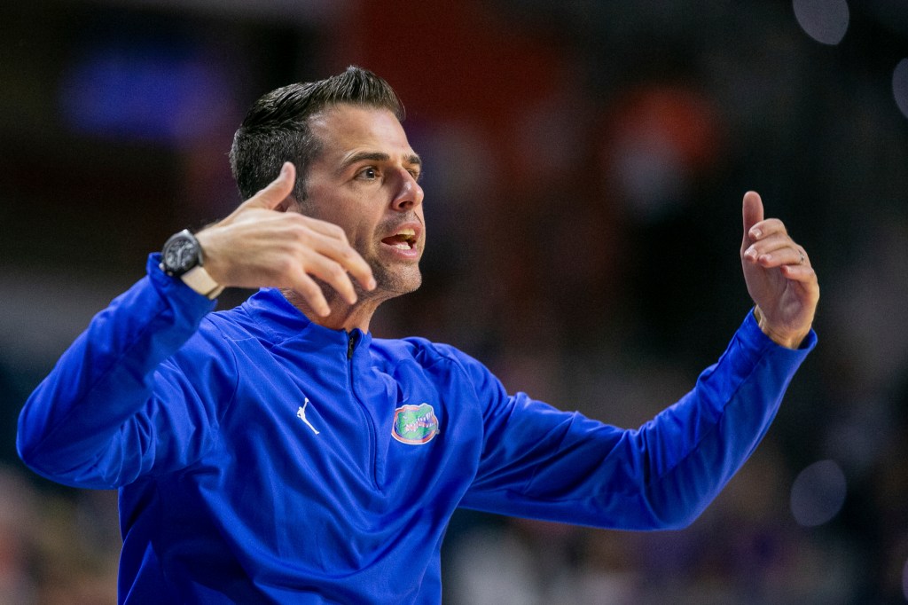 Florida head coach Todd Golden coaches form the siideline during the first half of an NCAA college basketball game against Jacksonville Thursday, Nov. 7, 2024, in Gainesville, Fla.