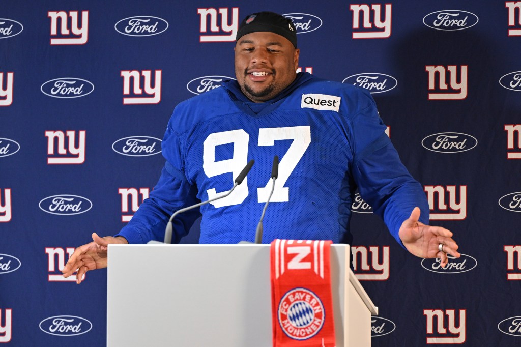 Dexter Lawrence talks with the media after a practice session in Munich, Germany on Nov. 8, 2024.