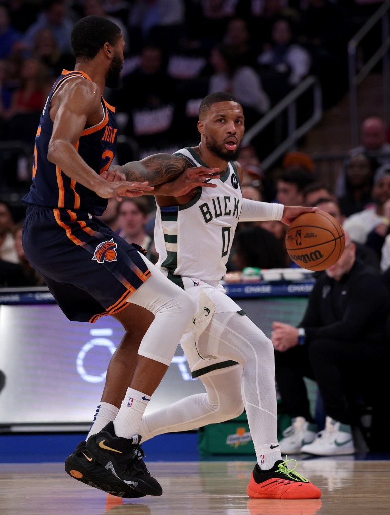 Mikal Bridges defends Damian Lillard during the Knicks' win over the Bucks. 