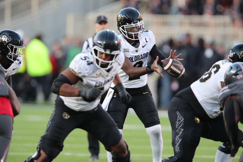 Buffalos quarterback Shedeur Sanders (2) takes a snap in the second half against the Texas Tech Red Raiders at Jones AT&T Stadium and Cody Campbell Field. 