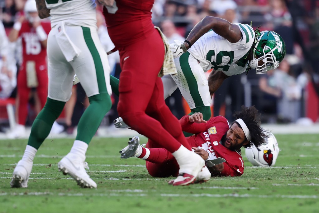 Quincy Williams #56 of the New York Jets hits Kyler Murray #1 of the Arizona Cardinals in the second quarter at State Farm Stadium on November 10, 2024 in Glendale, Arizona.