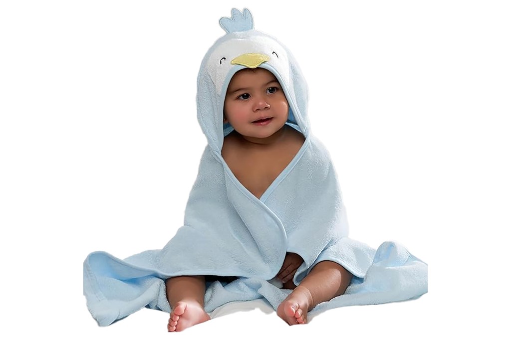 A baby wrapped in a blue towel