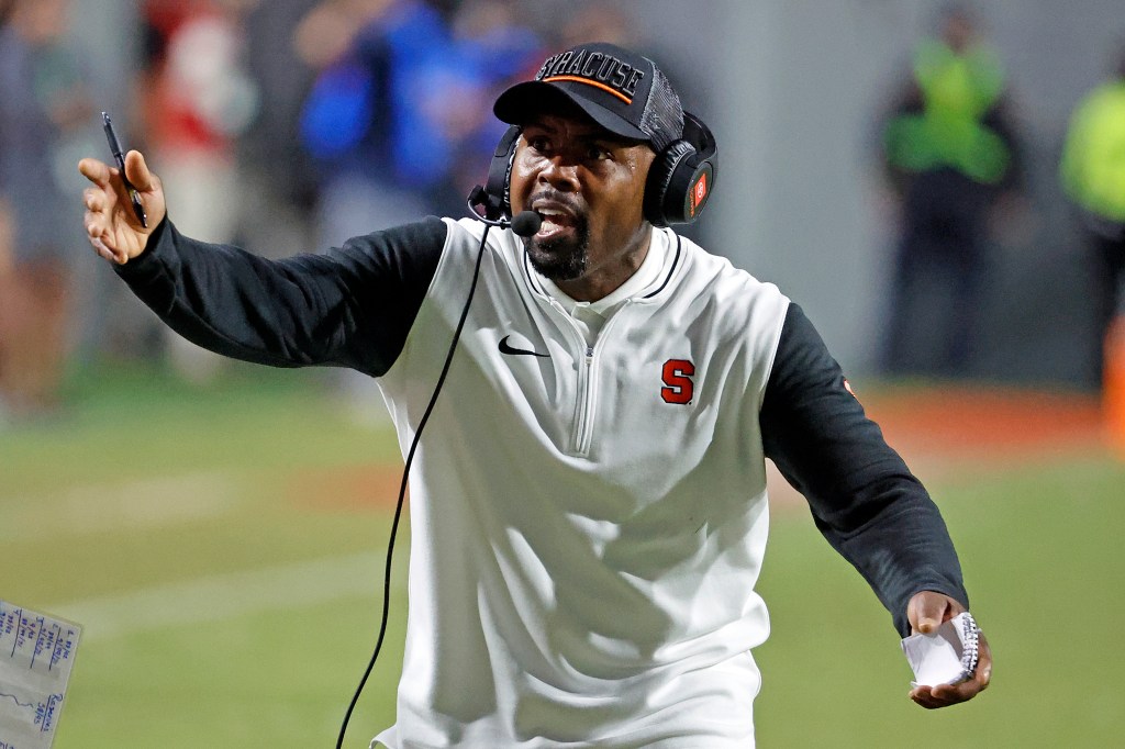 Syracuse head coach Fran Brown protests a call by an official during the first half of an NCAA college football game against North Carolina State 