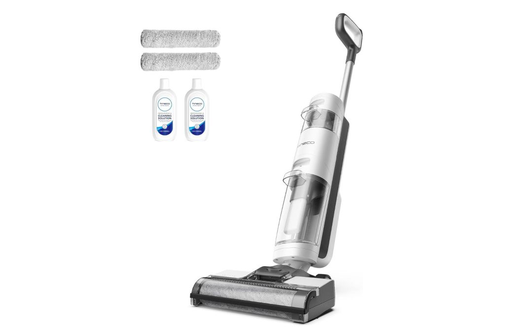 A white vacuum with accessories