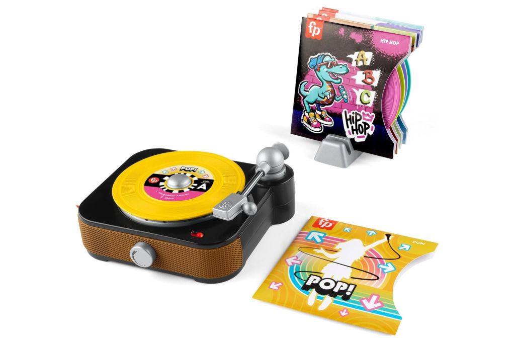 A mini toy record player and accessories.