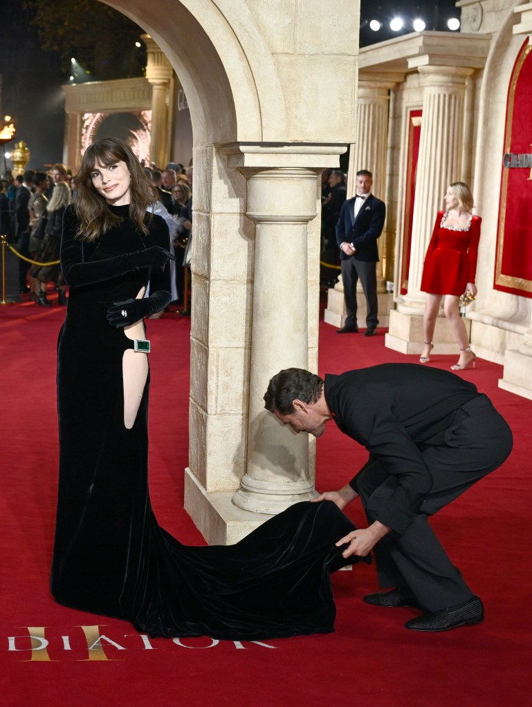 Pedro Pascal and Lux Pascal attending the Gladiator II premiere on a red carpet, Lux wearing a long black dress.