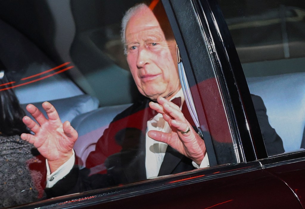 King Charles of Britain gesturing from inside a vehicle at the global premiere of 'Gladiator II' in London, November 13, 2024