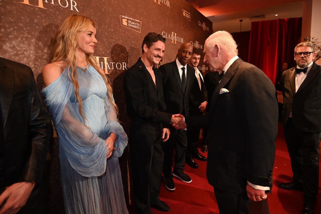 Connie Nielsen watching as King Charles III greets Pedro Pascal at the global premiere of 'Gladiator II' in London, with other celebrities present