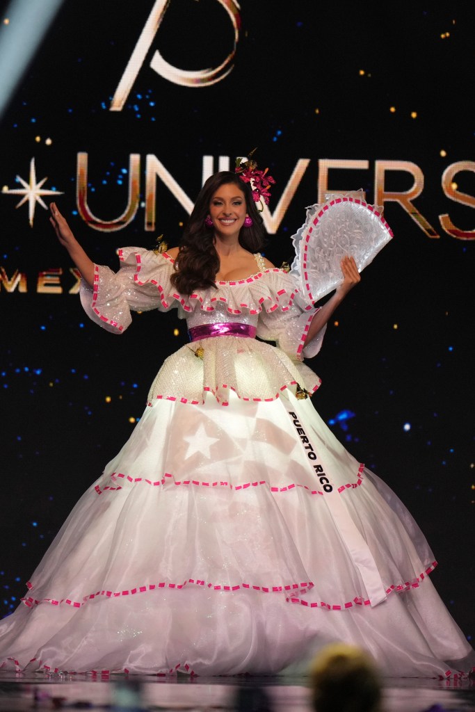 Miss Puerto Rico Jennifer Colón in a white dress competing in the national costume competition at the Miss Universe Beauty Pageant in Mexico City, 2024.