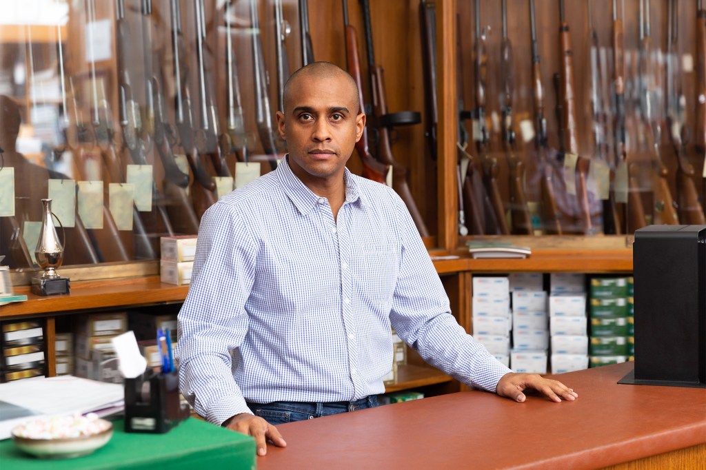 Elimu Nelson, a man standing behind a counter