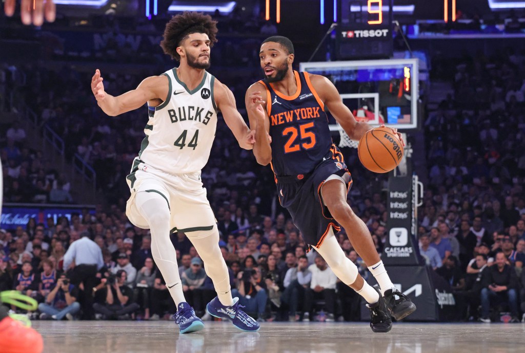 New York Knicks forward Mikal Bridges #25 drives down court as Milwaukee Bucks guard Andre Jackson Jr. #44 gives chase during the first inning.