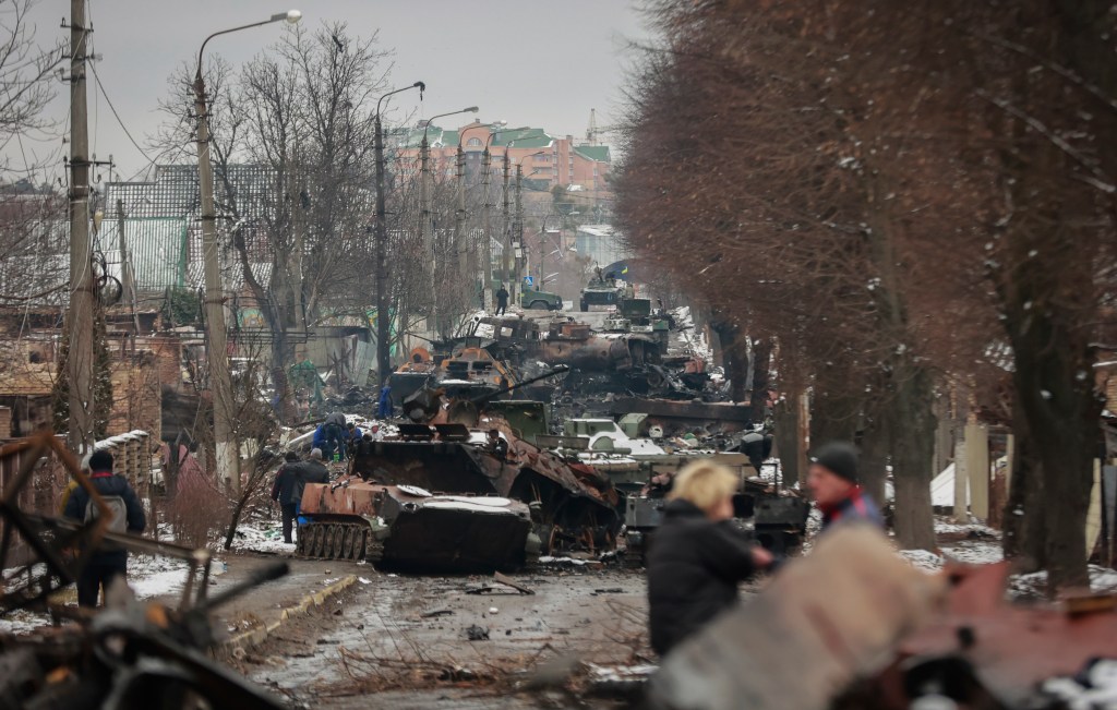 Gutted Russian military vehicles sit on a road just outside of Kyiv, Ukraine in March 2022.