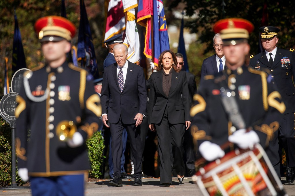 U.S. President Joe Biden and Vice President Kamala Harris walking towards the Tomb of the Unknown Soldier in Arlington National Cemetery to attend a wreath laying ceremony on Veterans Day