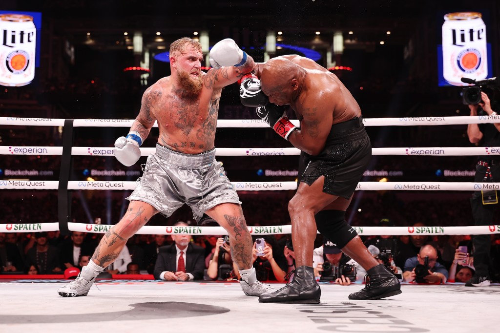 Mike Tyson attempts to dodge a punch from Jake Paul during their Netflix fight on Nov. 15.