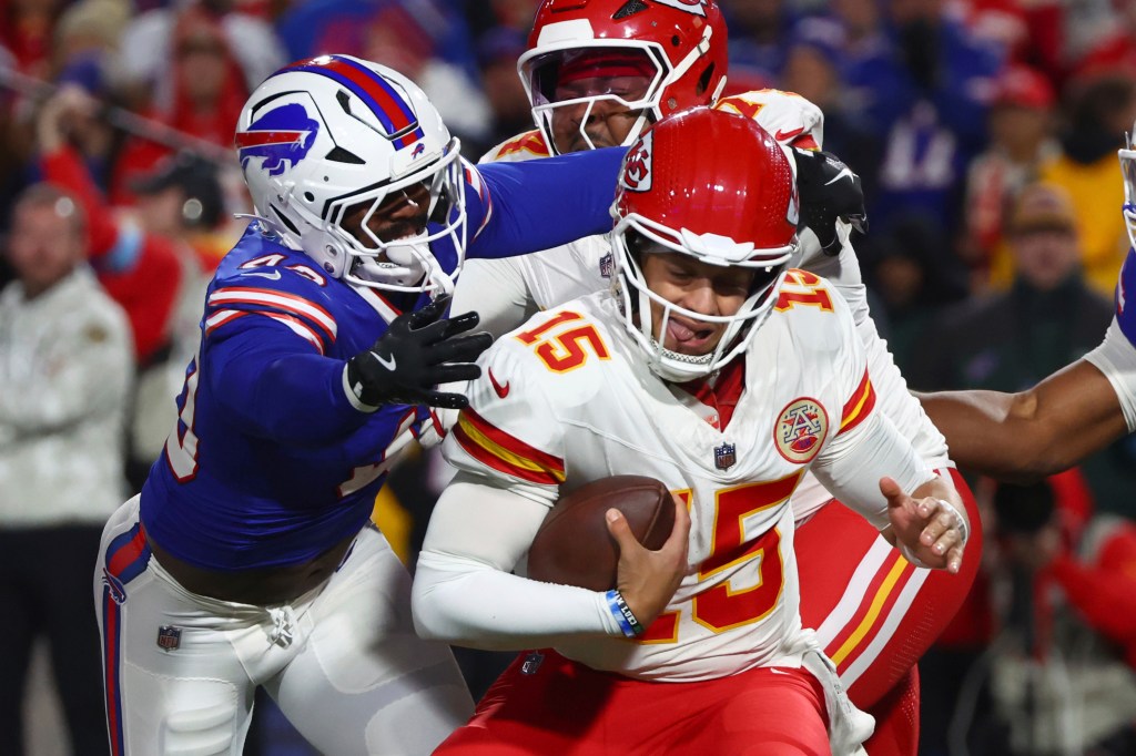 Kansas City Chiefs quarterback Patrick Mahomes (15) is pressured by Buffalo Bills linebacker Von Miller, left, during the first half of an NFL football game Sunday, Nov. 17, 2024.