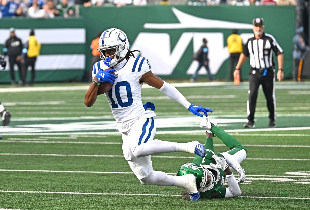 Adonai Mitchell #10 of the Indianapolis Colts breaks away from Sauce Gardner #1 of the New York Jets during the first quarter of the Jets and Indianapolis Colts game in East Rutherford, NJ.