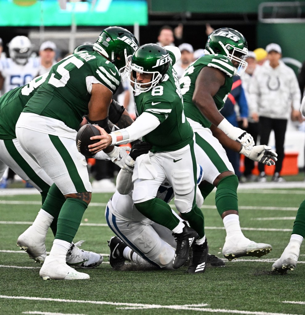 Jets quarterback Aaron Rodgers (8) is sacked by Indianapolis Colts defensive end Kwity Paye (51) on the last play of the game as the Indianapolis Colts defeated the Jets 28-27 in East Rutherford, NJ.