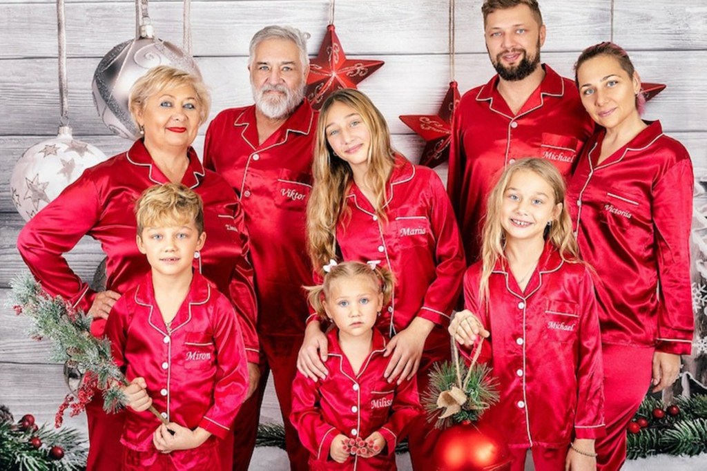 Family of 8 wearing Custom Christmas Family Pajamas - red with white detailing