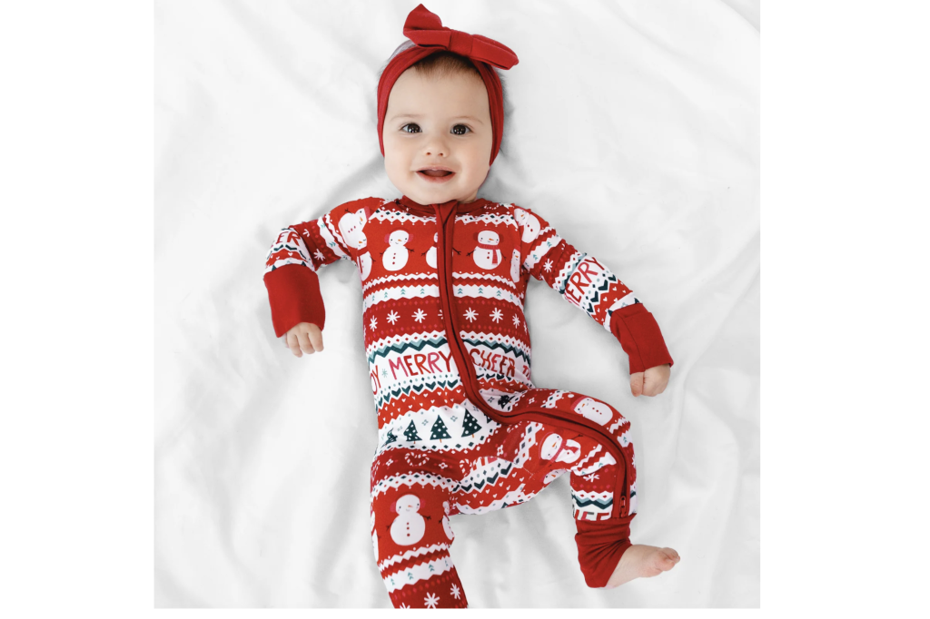 baby wearing Christmas onesie