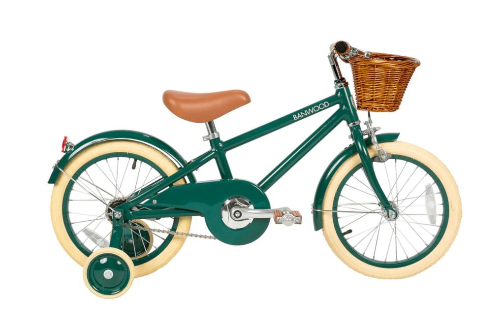 A retro style kids bike in cream and green.