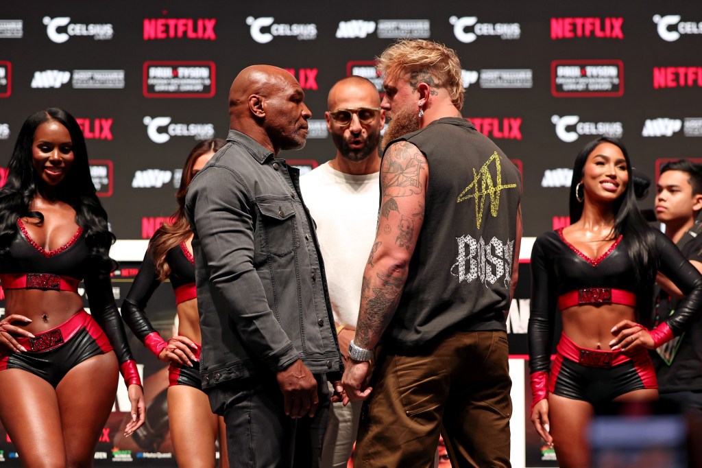 Mike Tyson, Nakisa Bidarian, and Jake Paul attend the press conference for LIVE on Netflix: Jake Paul vs. Mike Tyson at the Toyota Music Factory on November 13, 2024 in Dallas, Texas.