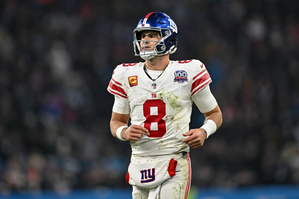 New York Giants quarterback Daniel Jones, benched, observing the game against the Carolina Panthers from the sidelines in Munich, Germany.