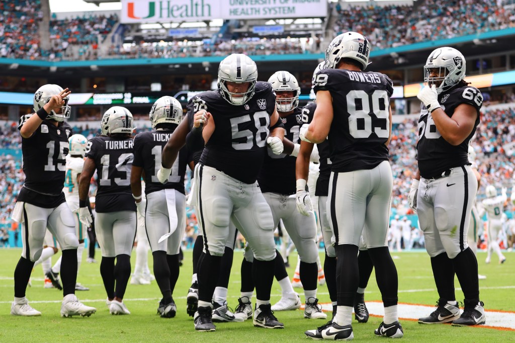 Las Vegas Raiders tight end Brock Bowers (89) celebrating with guard Jackson Powers-Johnson (58) after scoring a touchdown against the Miami Dolphins at Hard Rock Stadium in Miami Gardens, Florida