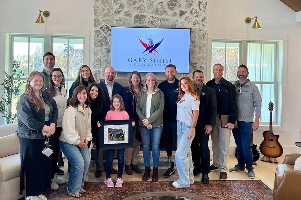 Army Sgt. Hargis and his family pose in their new home with the LP Building Solutions team