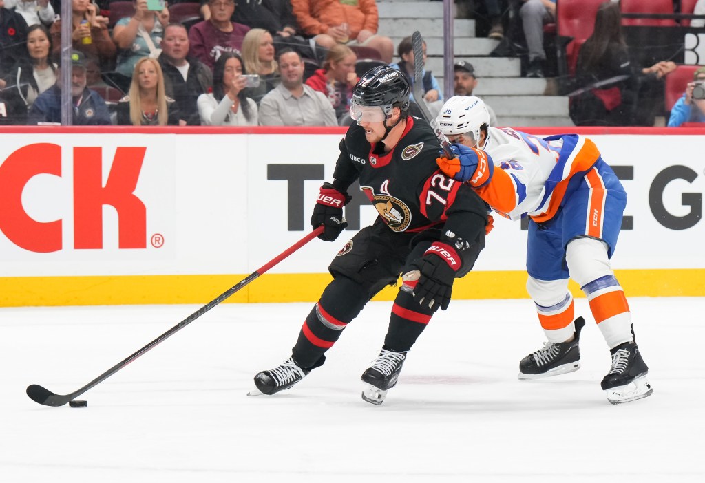 Isaiah George fights for the puck during the Islanders’ game against the Senators on Nov. 7.