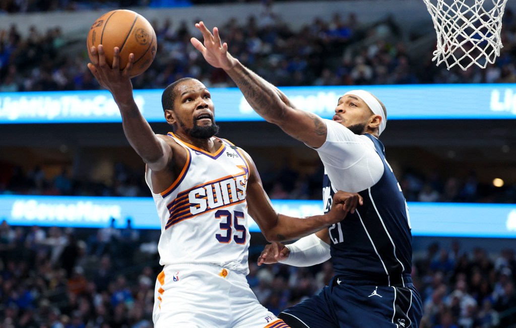 Phoenix Suns forward Kevin Durant (35) shoots past Dallas Mavericks center Daniel Gafford (21) during the third quarter at American Airlines Center. 