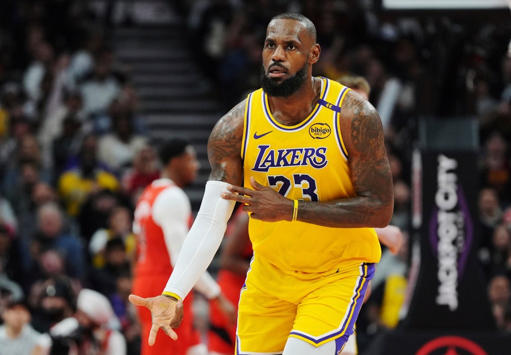 Los Angeles Lakers' LeBron James celebrates a three-pointer against the Toronto Raptors during the first half of an NBA basketball game in Toronto on Friday, Nov. 1, 2024. 