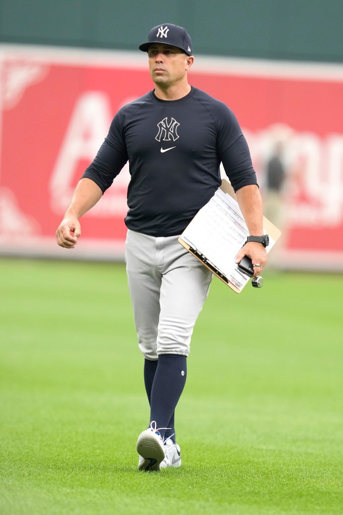 Assistant pitching coach Desi Druschel #79 of the New York Yankees walk back to the dug out before a baseball game against the Baltimore Orioles at the Oriole Park at Camden Yards on July 12, 2024 in Baltimore, Maryland.  