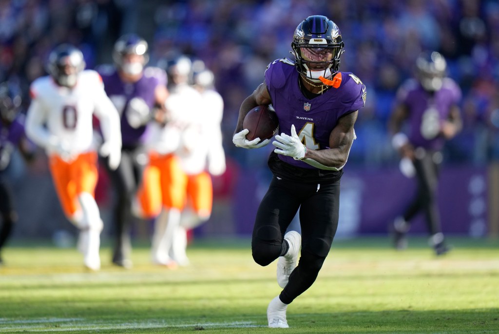 Baltimore Ravens wide receiver Zay Flowers runs for a touchdown after catching a pass in the second half of an NFL football game against the Denver Broncos, Sunday, Nov. 3, 2024, in Baltimore.