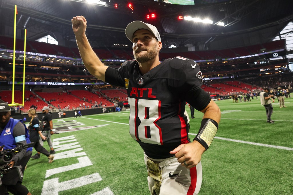 Atlanta Falcons quarterback Kirk Cousins (18) celebrates after a victory over the Dallas Cowboys at Mercedes-Benz Stadium.