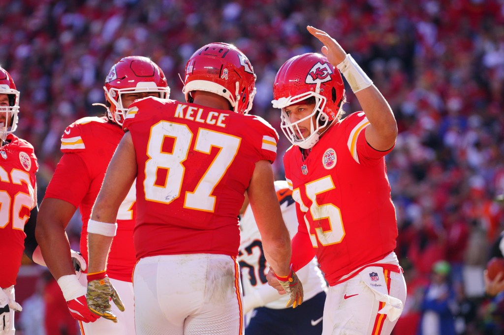 Kansas City Chiefs tight end Travis Kelce (87) celebrates with quarterback Patrick Mahomes (15) after scoring against the Denver Broncos during the first half at GEHA Field at Arrowhead Stadium. 